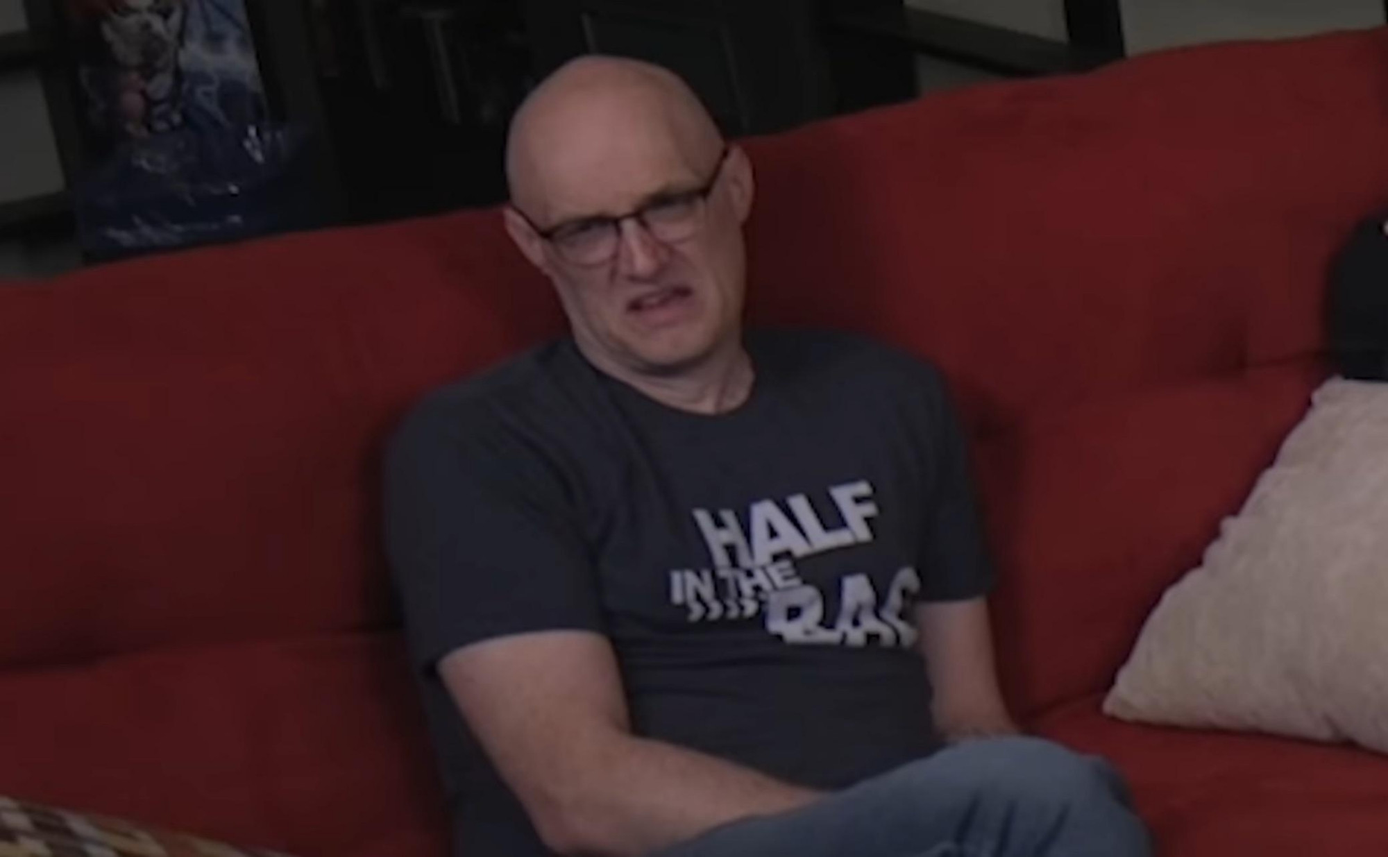 A picture of Jack Packard from an episode of Red Letter Media looking horrified at something he's watching on TV. 