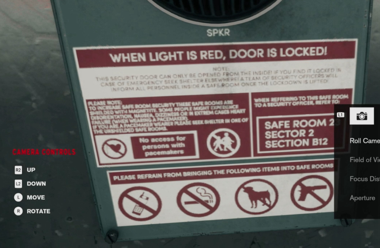 a screen cap of a warning label below a speaker on a shelter from the game control; the text reads:

WHEN LIGHT IS RED, DOOR IS LOCKED!
Note: This security door can only be opened from the inside! If you find it locked in case of emergency seek shelter elsewhere! A team of security officers will inform all personnel inside a saferoom once the lockdown is lifted!

Please note: To increase safe room security these safe rooms are shielded with magnetite. Some people might experience disorientation, nausea, dizziness or in extreme (sic) cases heart failure (when wearing a pacemaker). If you are a pacemaker wearer please seek shelter in one of the unshielded safe rooms.

No access for persons with pacemakers

When referring to this safe room to a security officer, refer to: Safe Room 2B Sector 2 Section B12

Please refrain from bringing the following items into safe rooms:

below this text are icons showing that cell phones, cigarettes, dogs, and firearms are prohibited inside