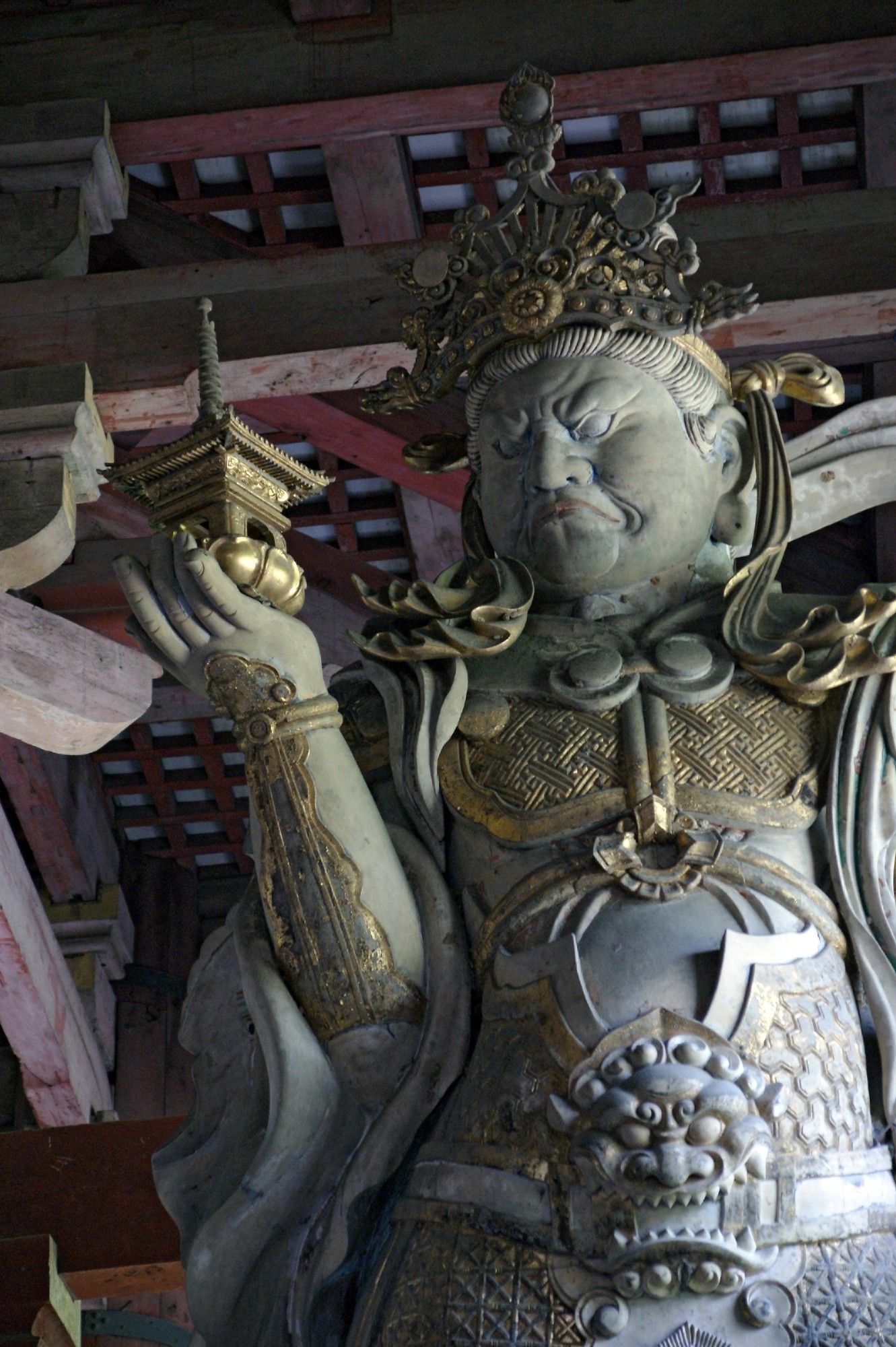 Statue of Vaiśravaṇa (aka Bishamon, aka Tamon-ten) holding a small pagoda at Todaiji Temple, Nara (photo by "663highland")