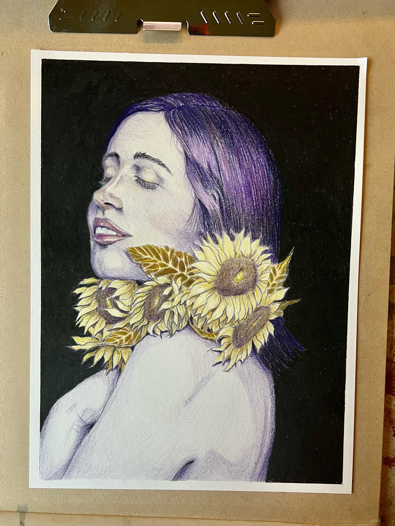 Portrait done in purple and yellow colored pencils. “Persephone.” Purple hair and cuddling with a bouquet of sunflowers.