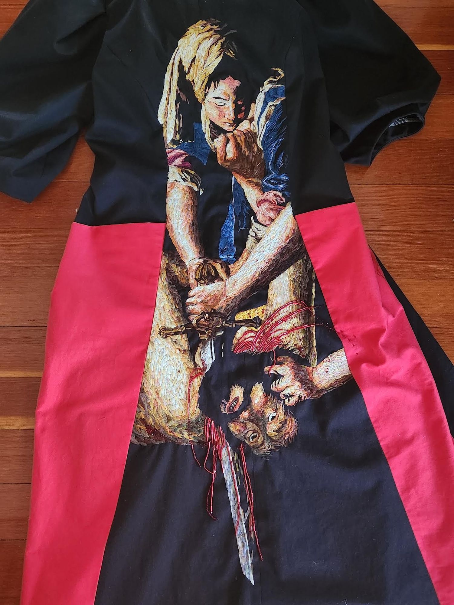 The same dress on the ground, spread out so the design can be seen flat. Artemisia Gentileschi’s Judith Slaying Holofernes.