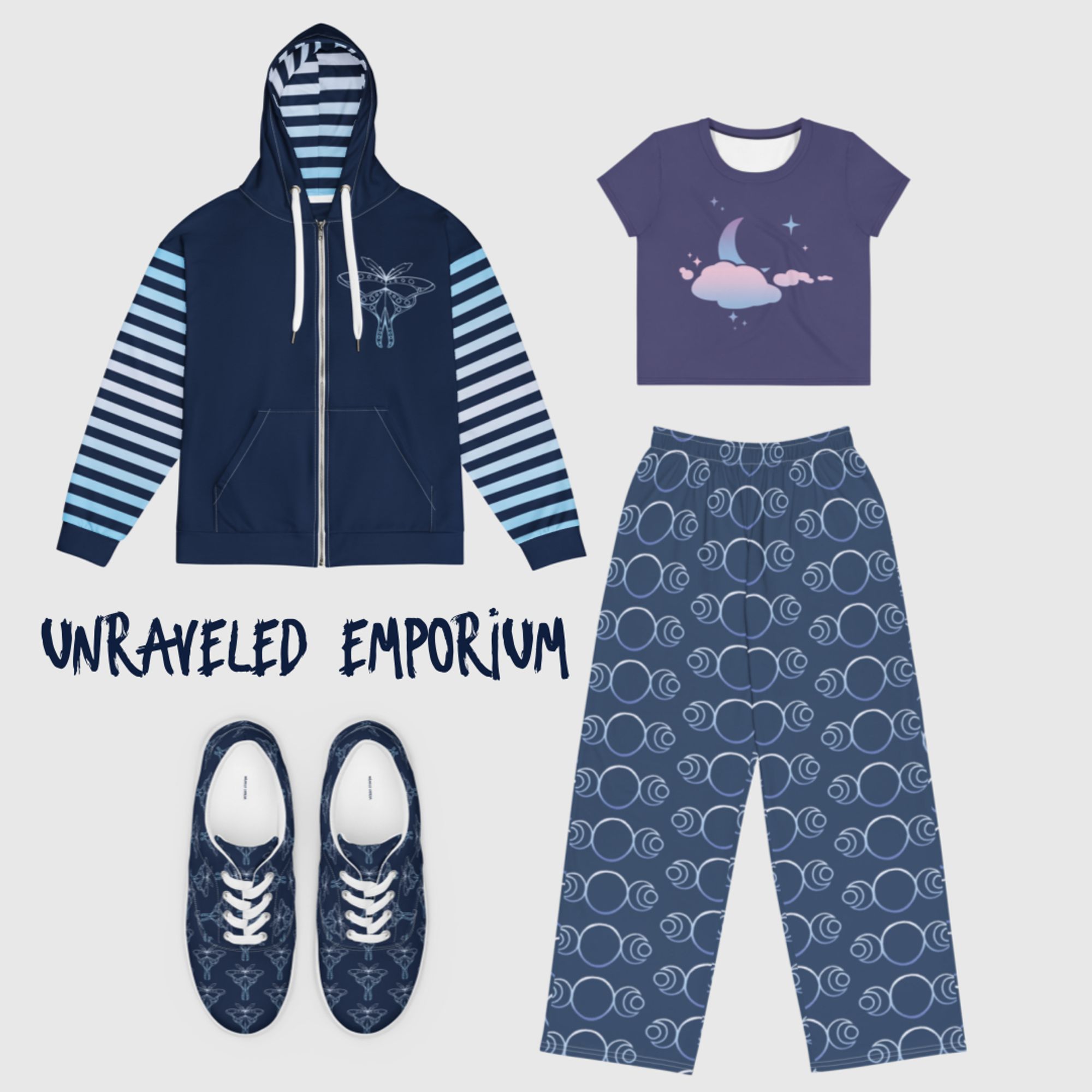 Clothing items. The hoodie and shoes are dark blue with light blue designs of a moon moth. The crop top is dusky purple with a pastel purple blue and pink moon and clouds. The pants are blue with lighter blue moon designs. Text reads "Unraveled Emporium"