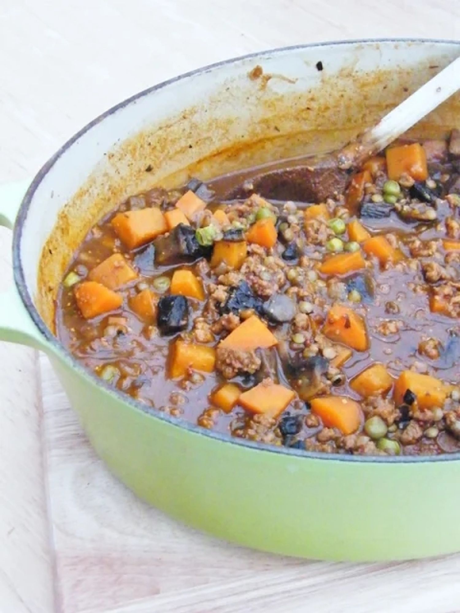 Vegetable and lentil stew in a cast iron pot.