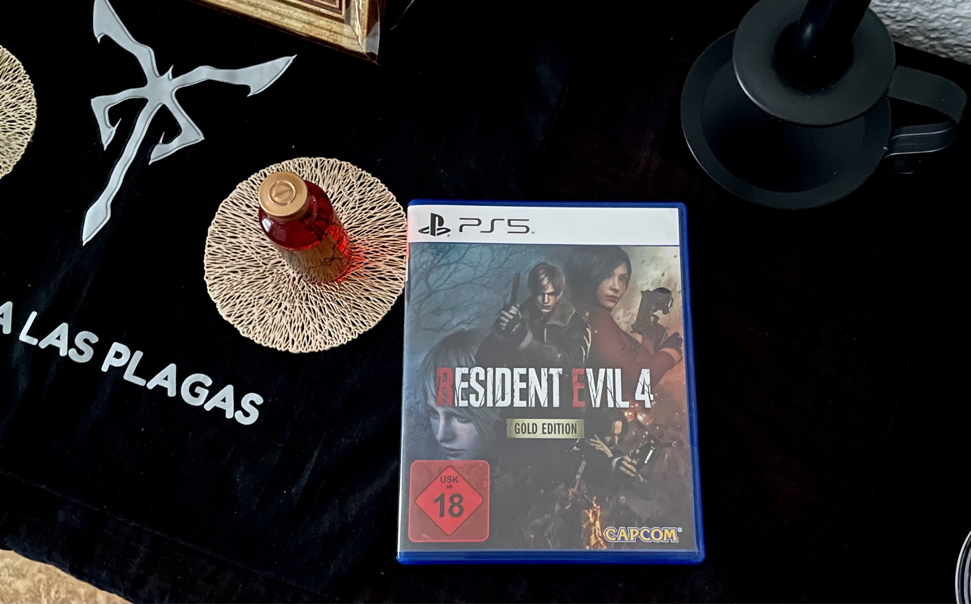 Resident Evil 4 Remake's Gold Edition for PS5 on my Osmund Saddler shrine