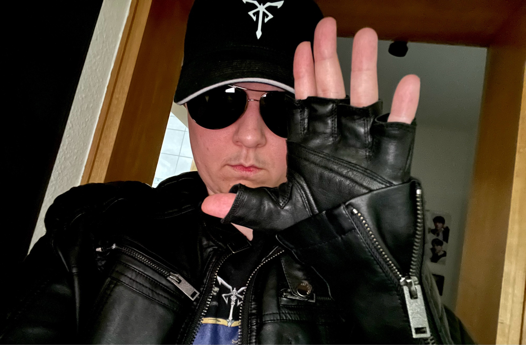 Me wearing my black Los Iluminados hat, my black fingerless leather gloves, my black leather jacket