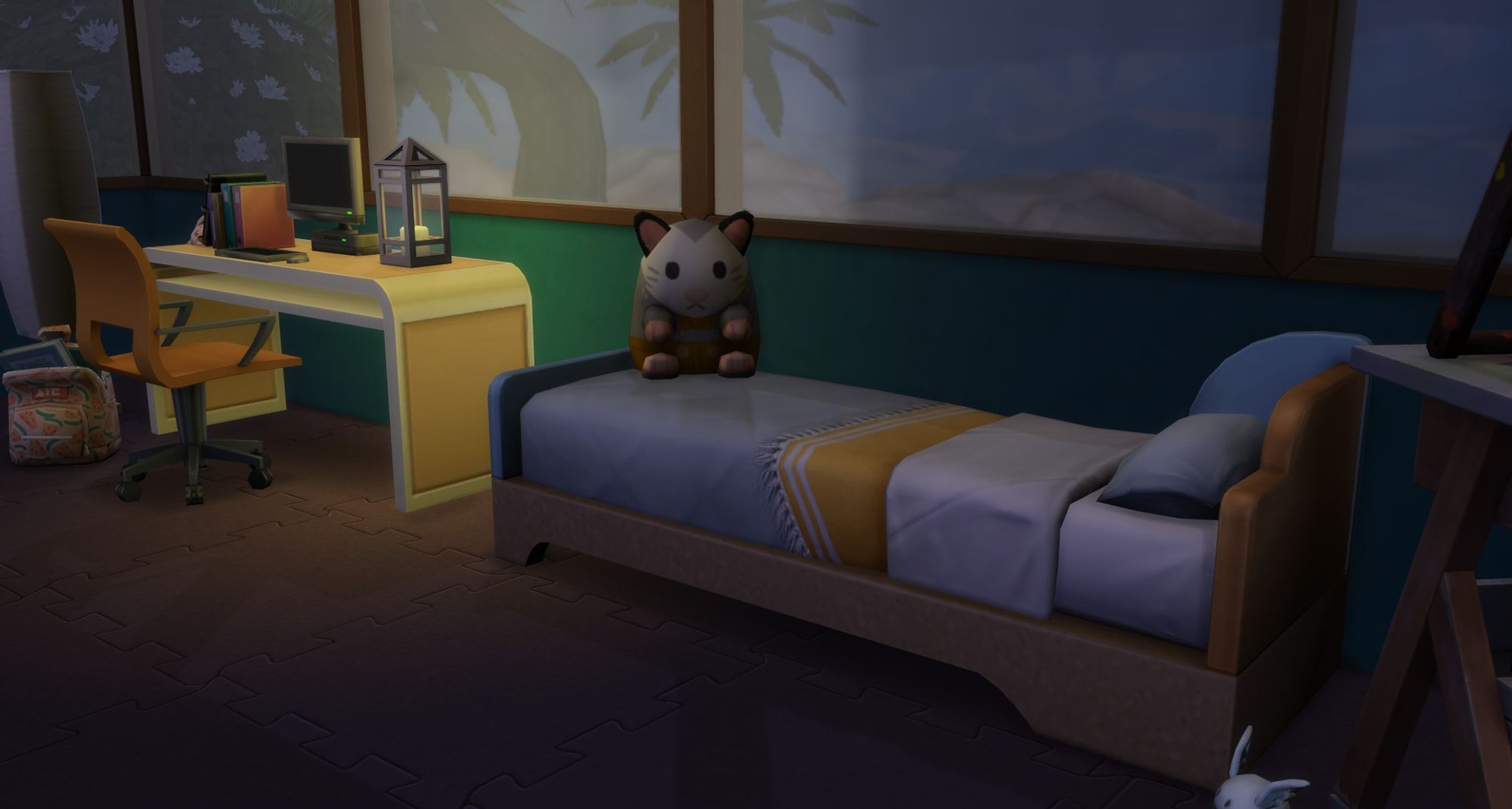 The possum plushie from the new storybook nursery kit sitting on Miley Landgraab's bed.