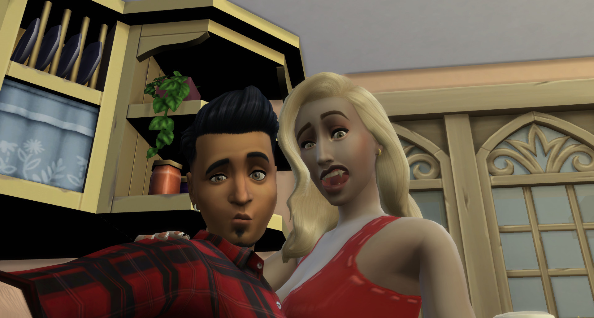 Gunner and Dina pulling funny faces in a selfie. You can see Dina's fangs!