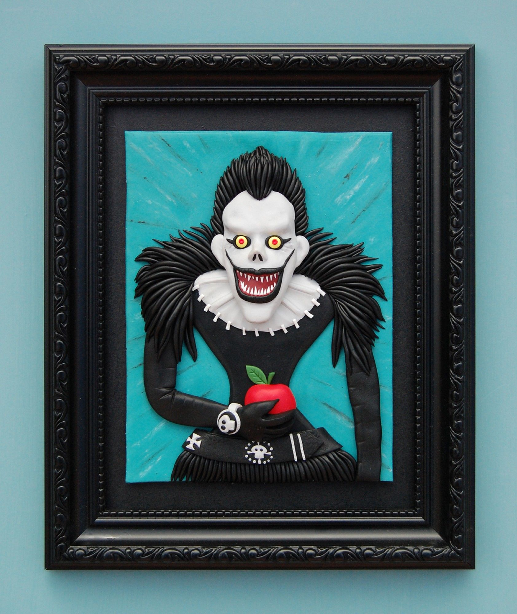 My polymer clay painting of Ryuk of Death Note in a black shabby frame