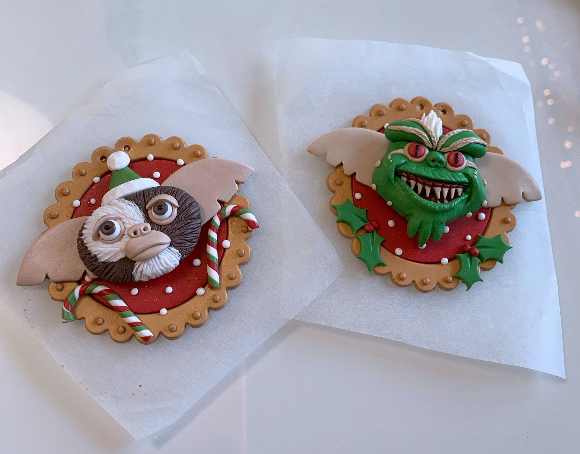 My Christmas tree ornaments of Gizmo and Stripe from Gremlins. Gizmo has Candy canes and snow as decoration and Stripe has snow and holly.