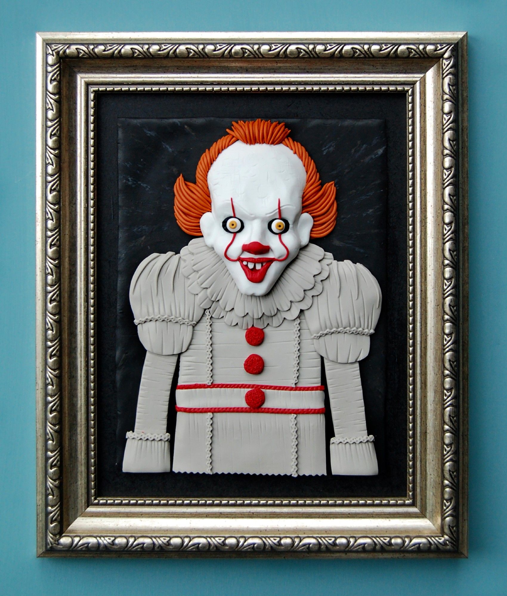 My polymer clay painting of Pennywise the Clown in a shabby frame