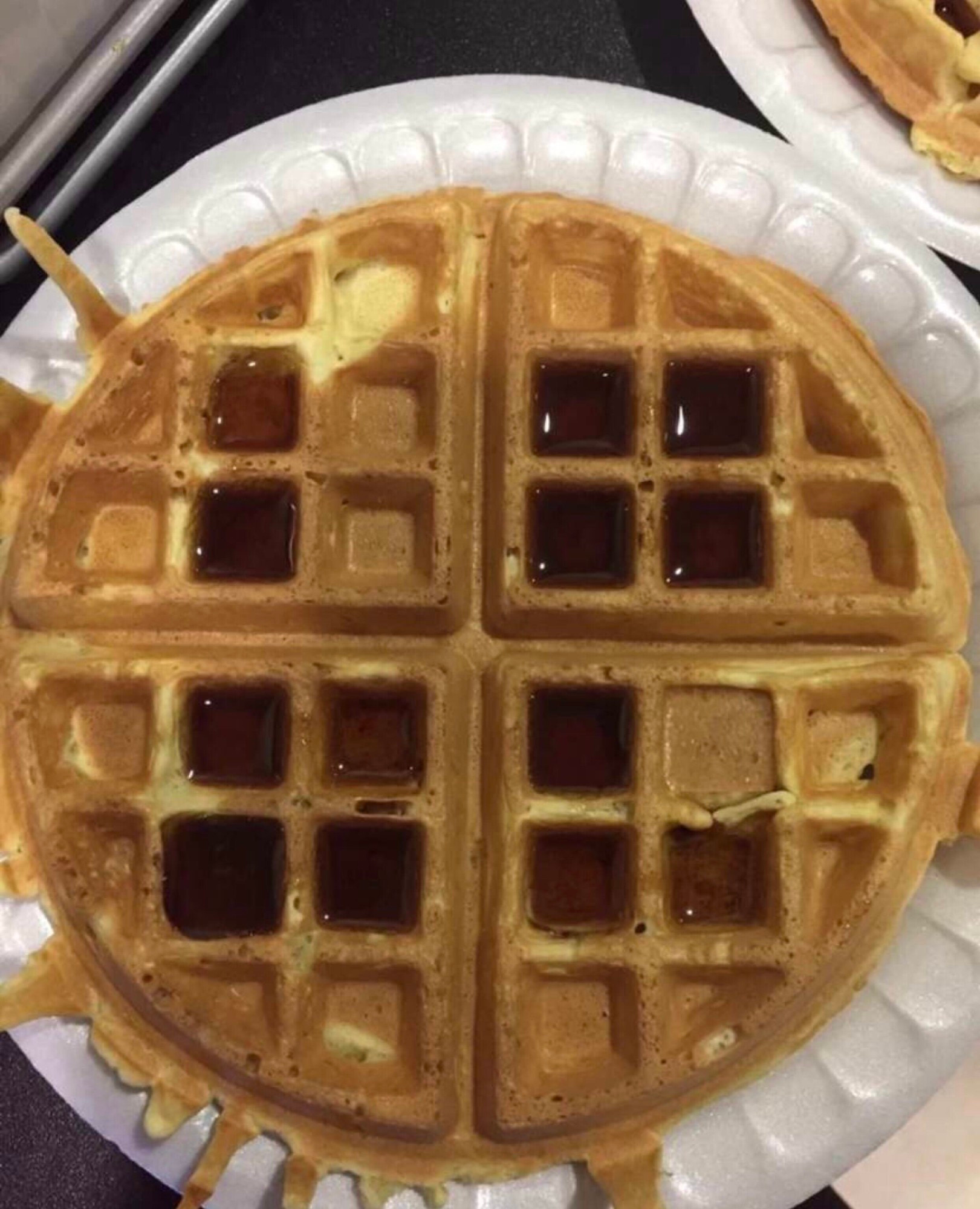 A picture of a waffle with a topping of
I II
II I_