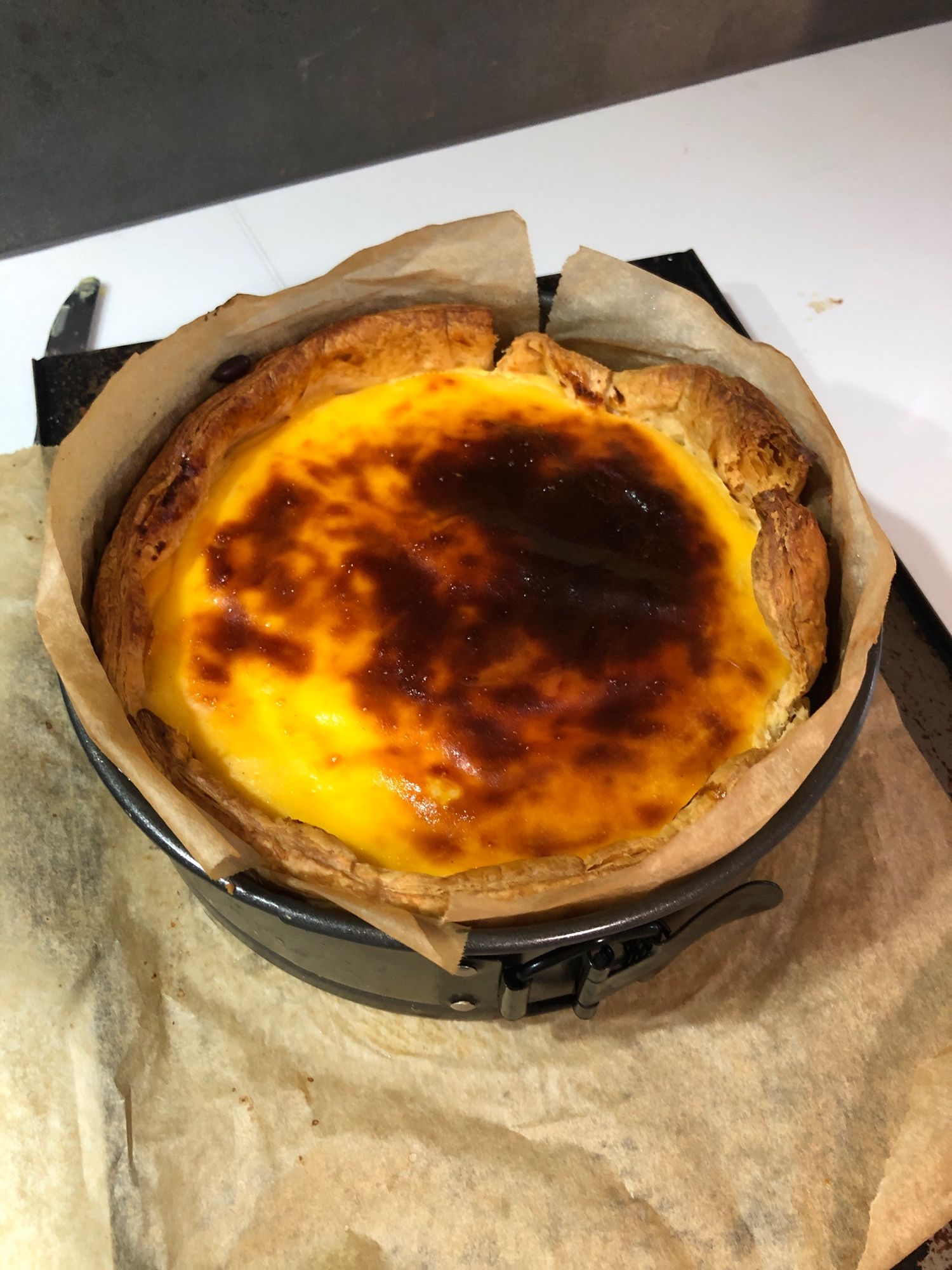 Flan patisserie fresh out of the oven cooling down. Perfect amount of browning on the top. Can't wait to eat it but have to wait till tomorrow for it to have cooled down apparently.