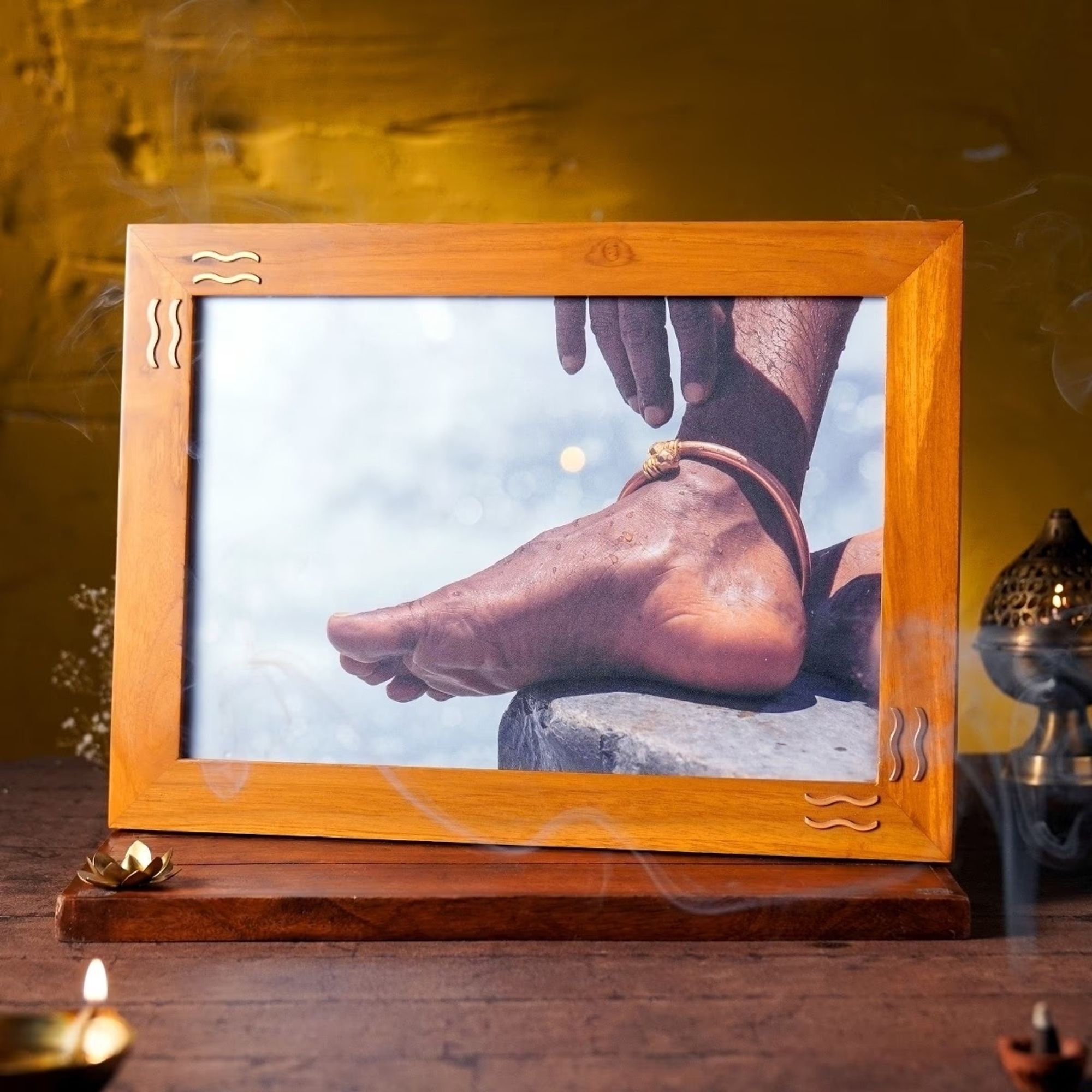 A wood-framed photograph of Jaggi Vasudev’s feet. Vasudev, who calls himself Sadhguru, is offering this for sale at ₹3,200 a pop.