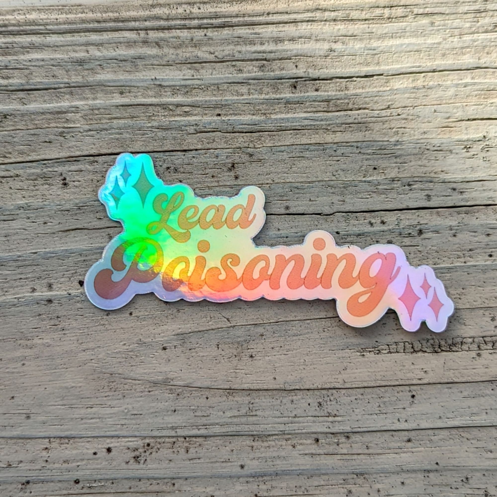 A holographic sticker that says lead poisoning