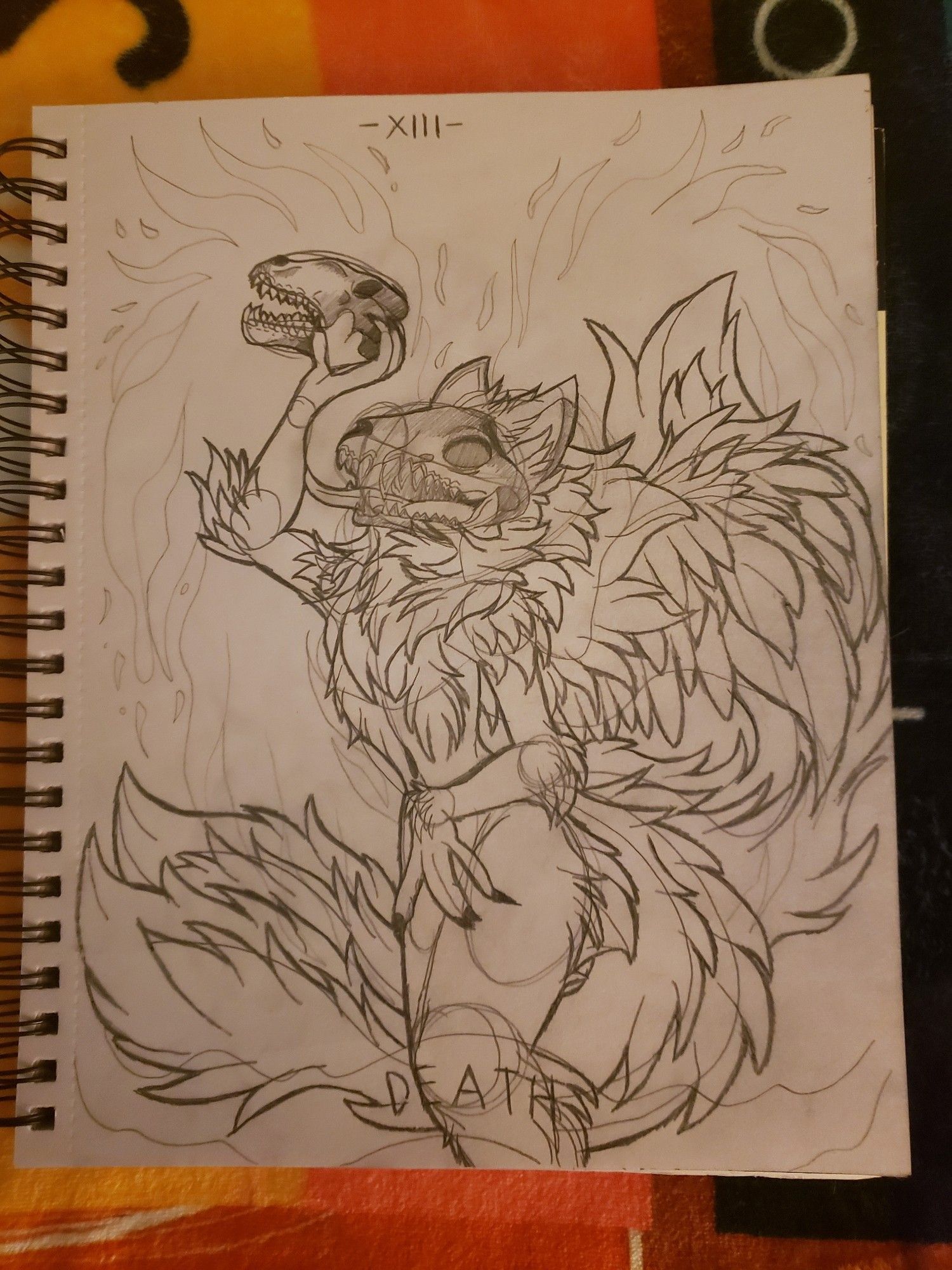 WIP sketch of the "Death" tarot card design. Scorpio Energy. A skull fox-like creature holding a skull in one hand symbolic of death and the winged flames representing rebirth and transformation.