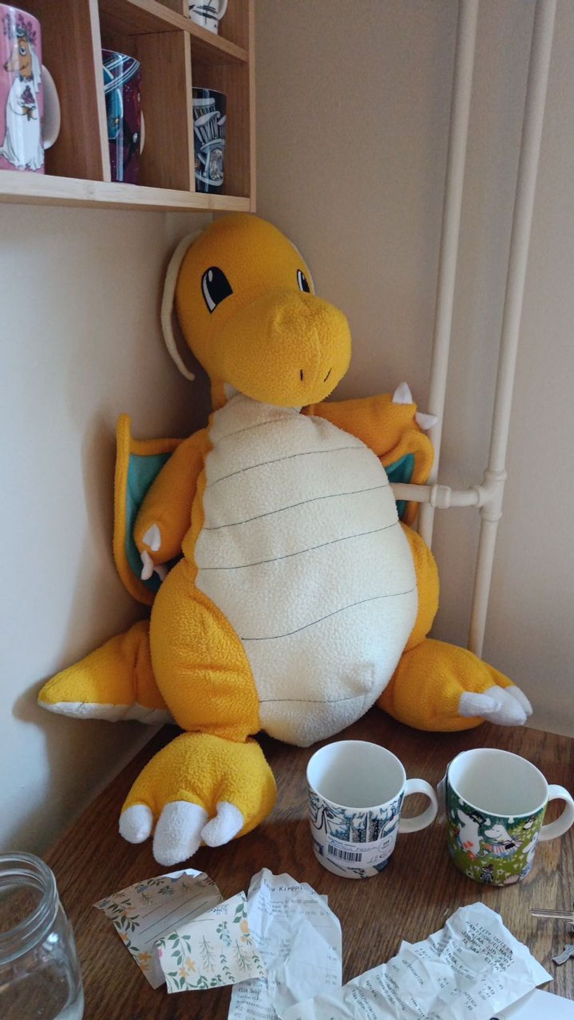 A big Dragonite Pokemon plushie that is yellow and white and very soft