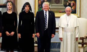 Creepy looking trump family visiting the Vatican. Trump females dressed in black with veils over hair. Donnie grinning like a clown and Pope just looks uncomfortable to be in the presence of demons. 
