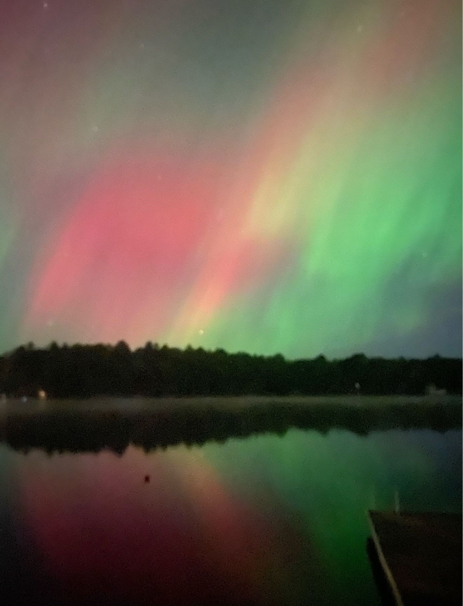 Aurorae in the sky and reflected in the lake