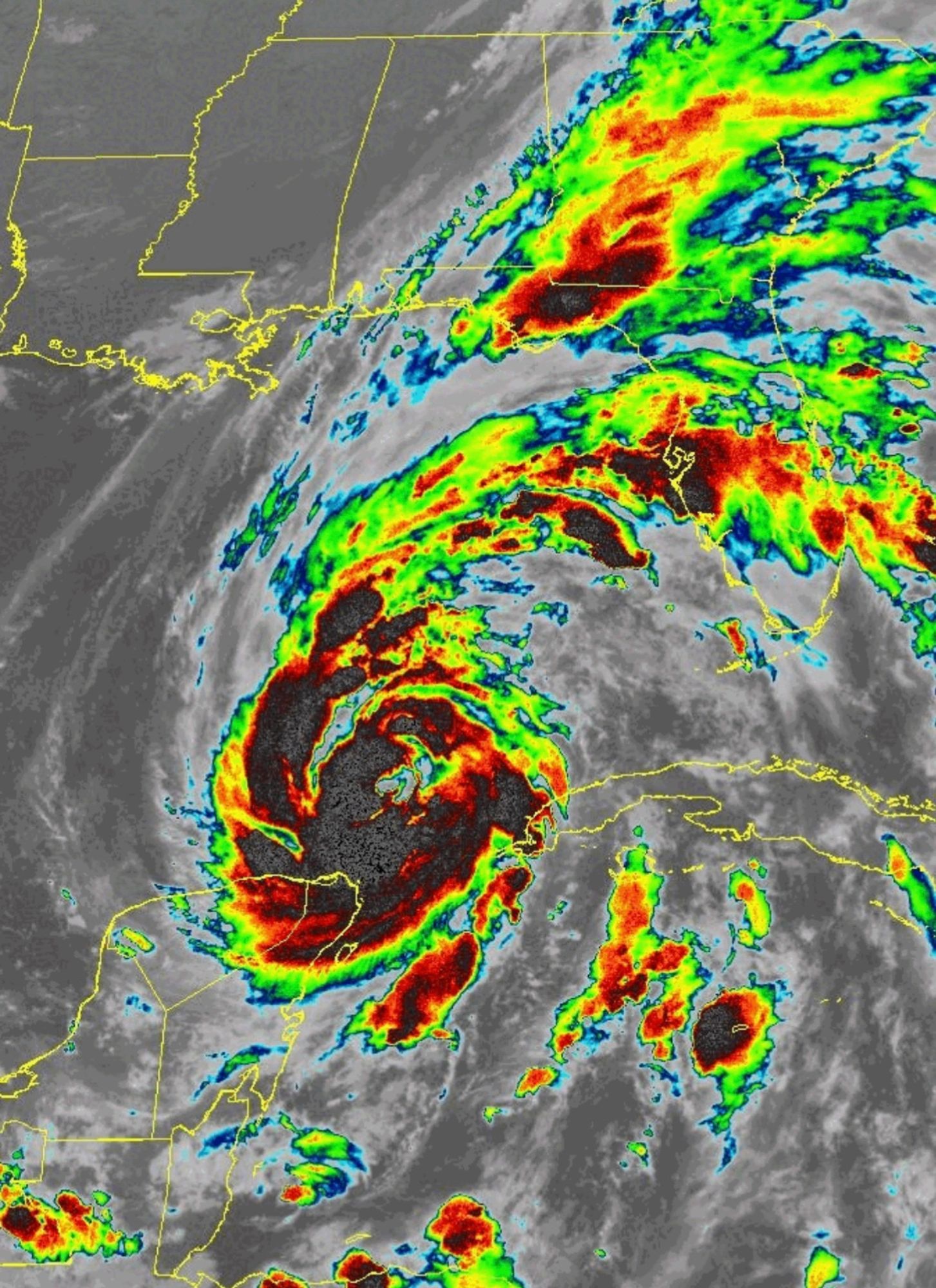 Shortwave infrared image of Hurricane Helene, showing a dark red core and inner bands with green, yellow and red outer bands stretching hundreds of miles