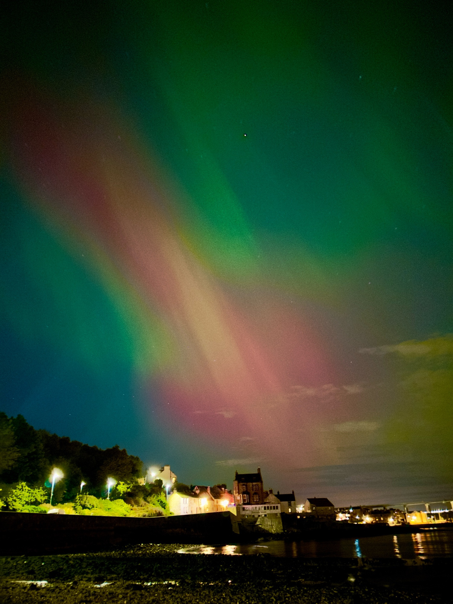 The aurora Borealis over the sea and Queensferry 