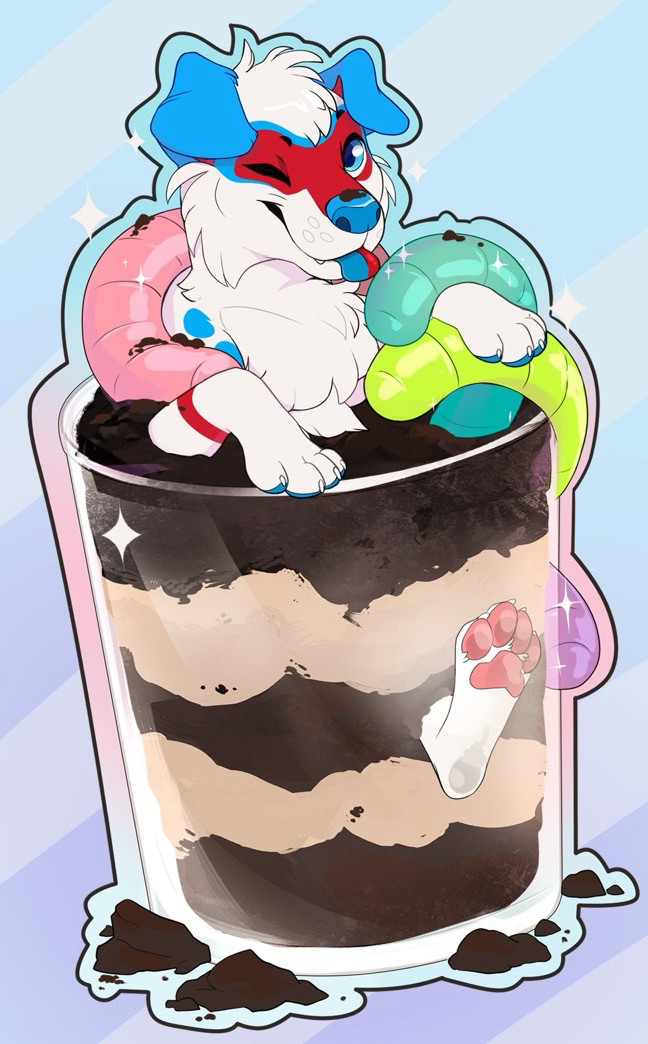 A red/blue/white dog looking cheeky while buried in a dirt cup (dessert made of pudding, cookies, and gummy worms)