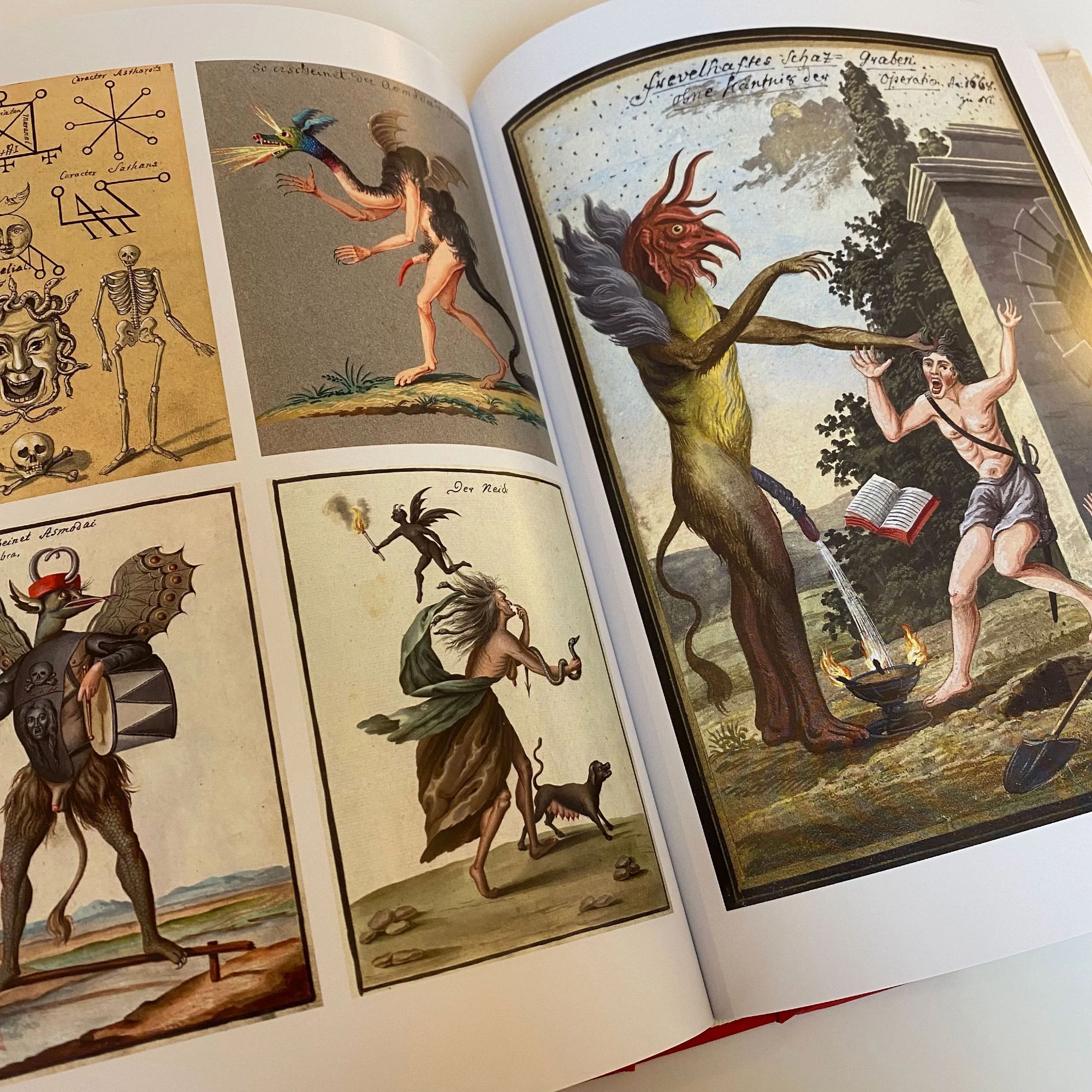 Two page spread of demon illustrations, part-animal part-beast creatures including one breathing fire, one surrounded by magickal sigils, one pissing on a man's fire and grabbing a man by his hair, making him drop his book as he screams in fear