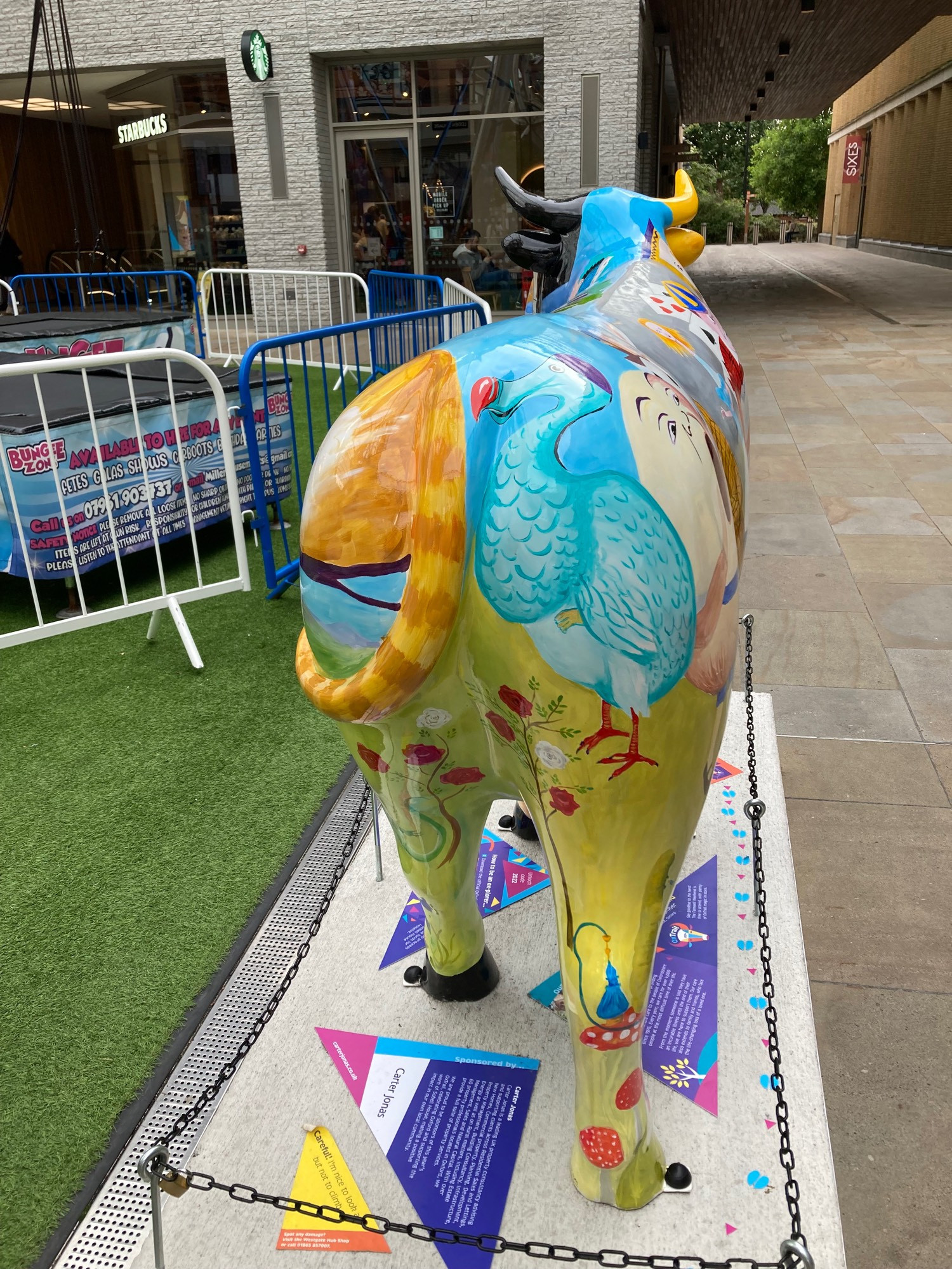 back view of ox sculpture with the dodo from Alice in Wonderland painted on