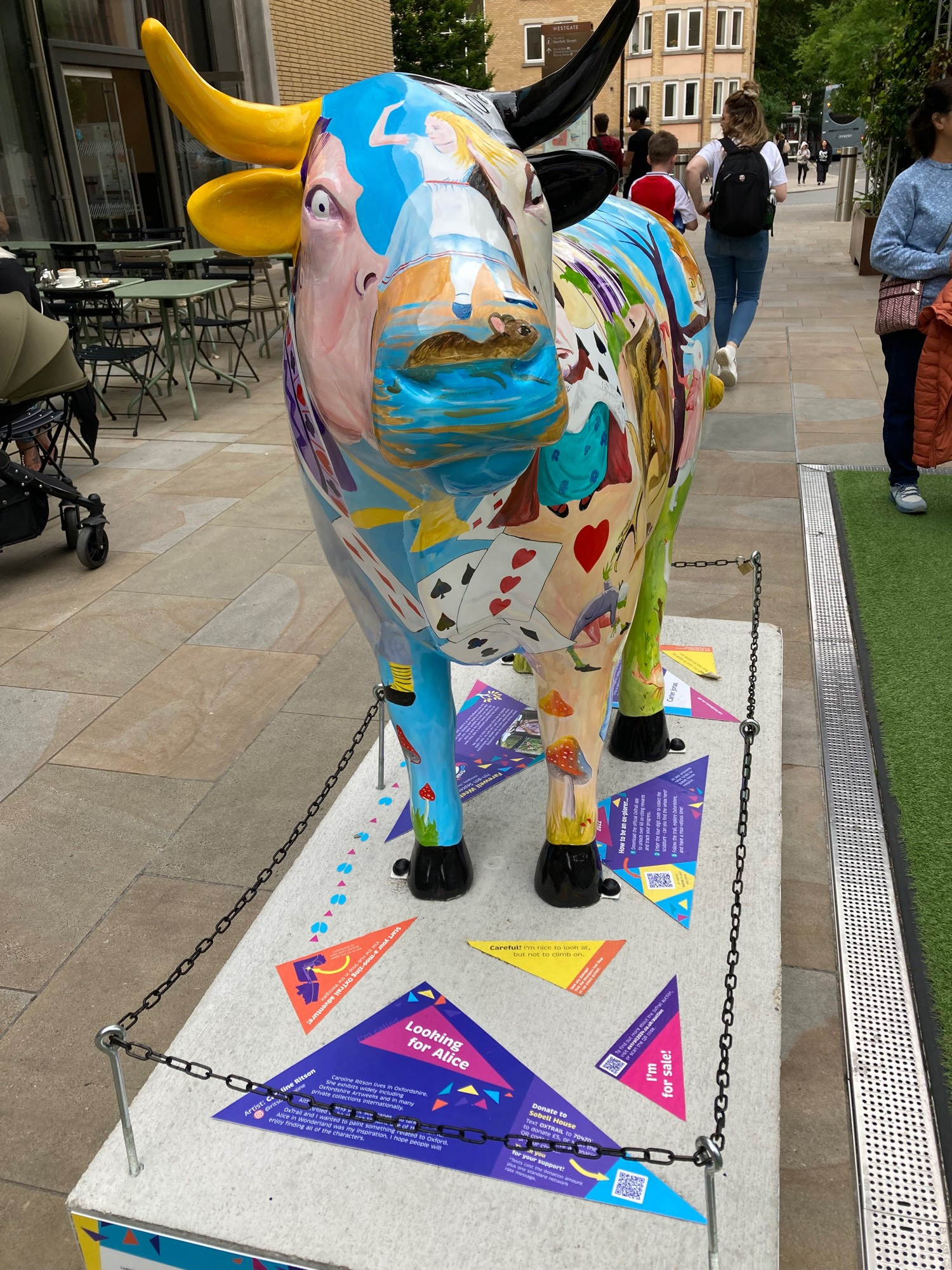 front view of ox sculpture Alice in Wonderland and playing cards painted on