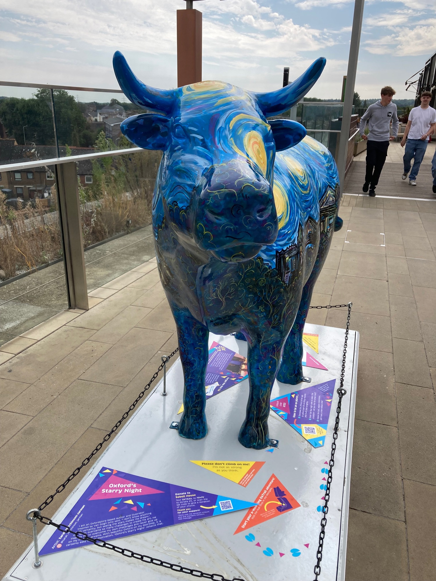 front view ox sculpture in style of van gogh starry night. Deep blue with yellow swirls