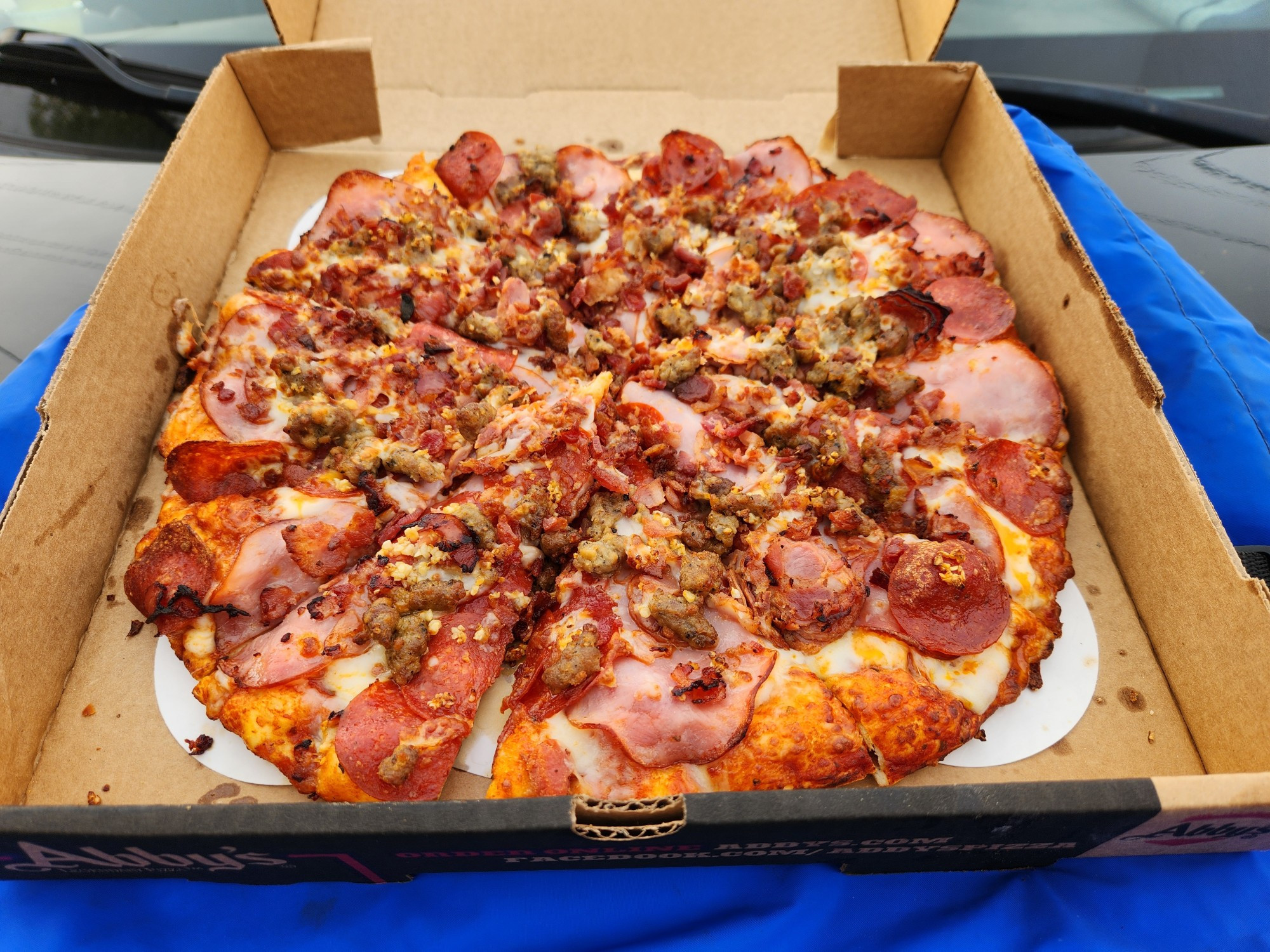 Pizza with lots of meat toppings