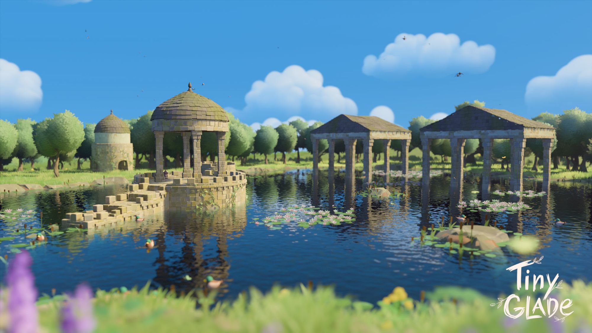 A screenshot from Tiny Glade. Stone ruins of broken towers, Greek-style temples, and a gazebo are flooded by a small lake.