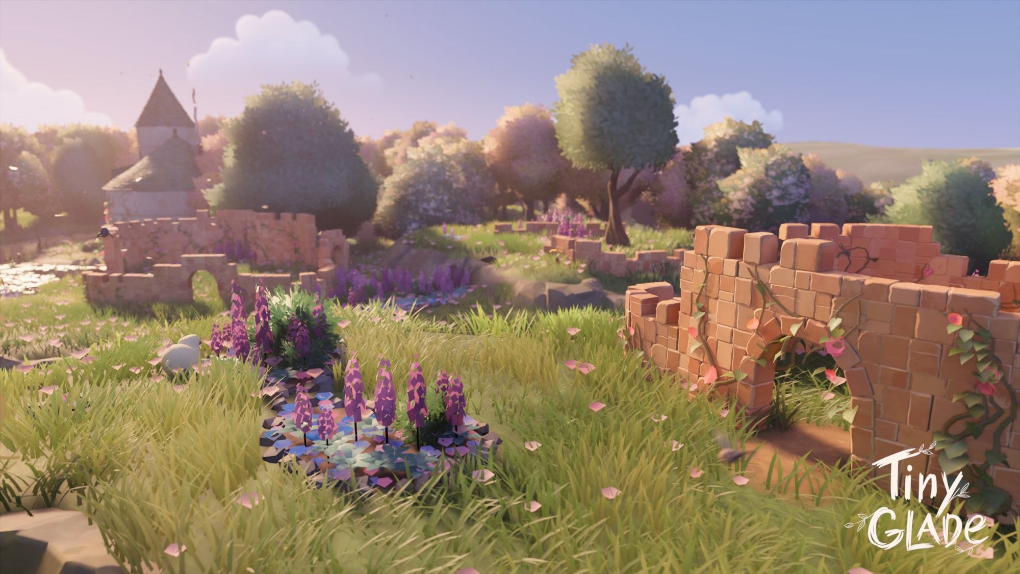 A screenshot of a build from Tiny Glade. Stone ruins overgrown with vines and flowers sit atop a hill, with a pair of towers far in the background.