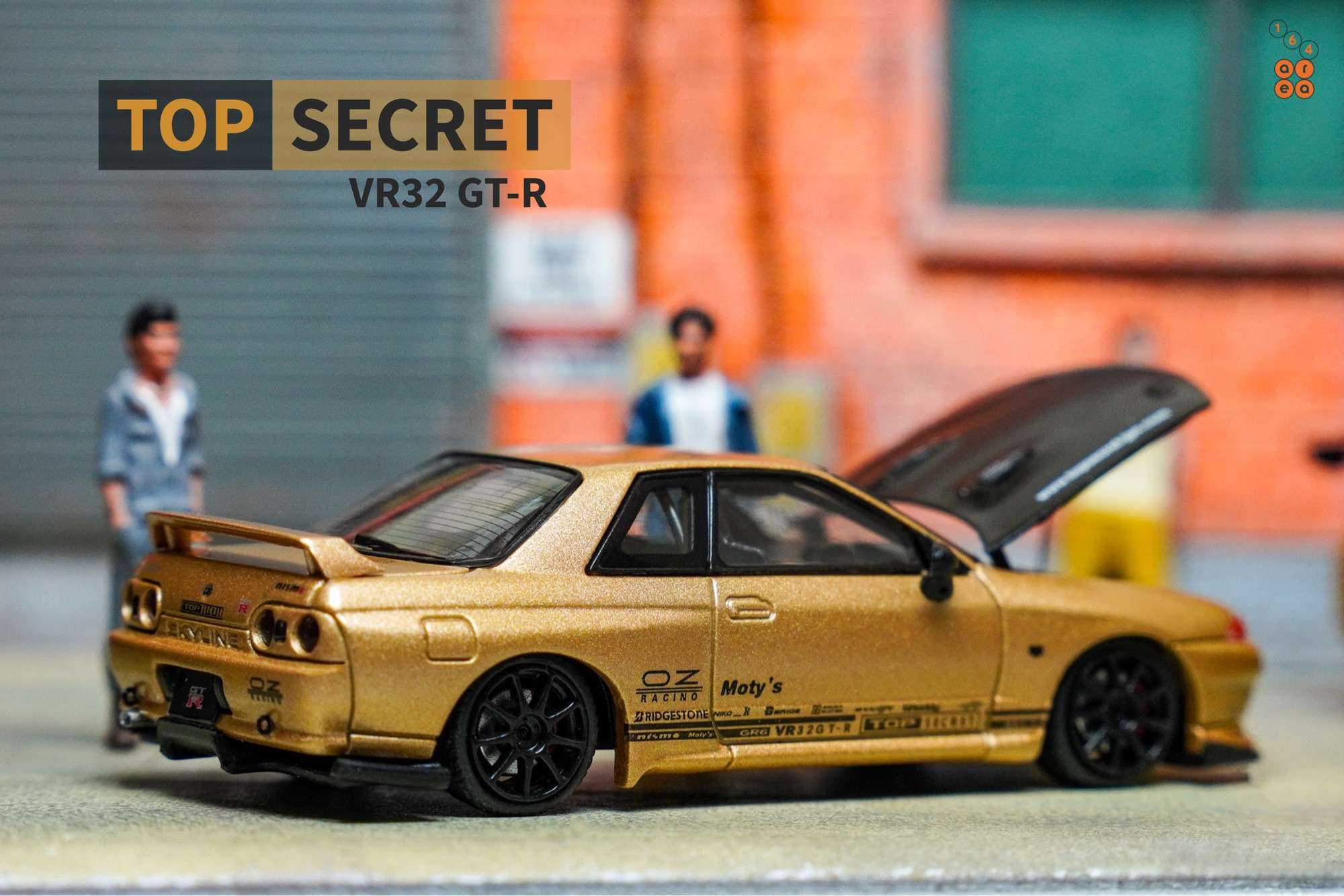 A right side of Nissan Skyline GT-R VR32 Top Secret Gold by Facal Horizon in 1:64 scale with 1:64 figure on AREA 164