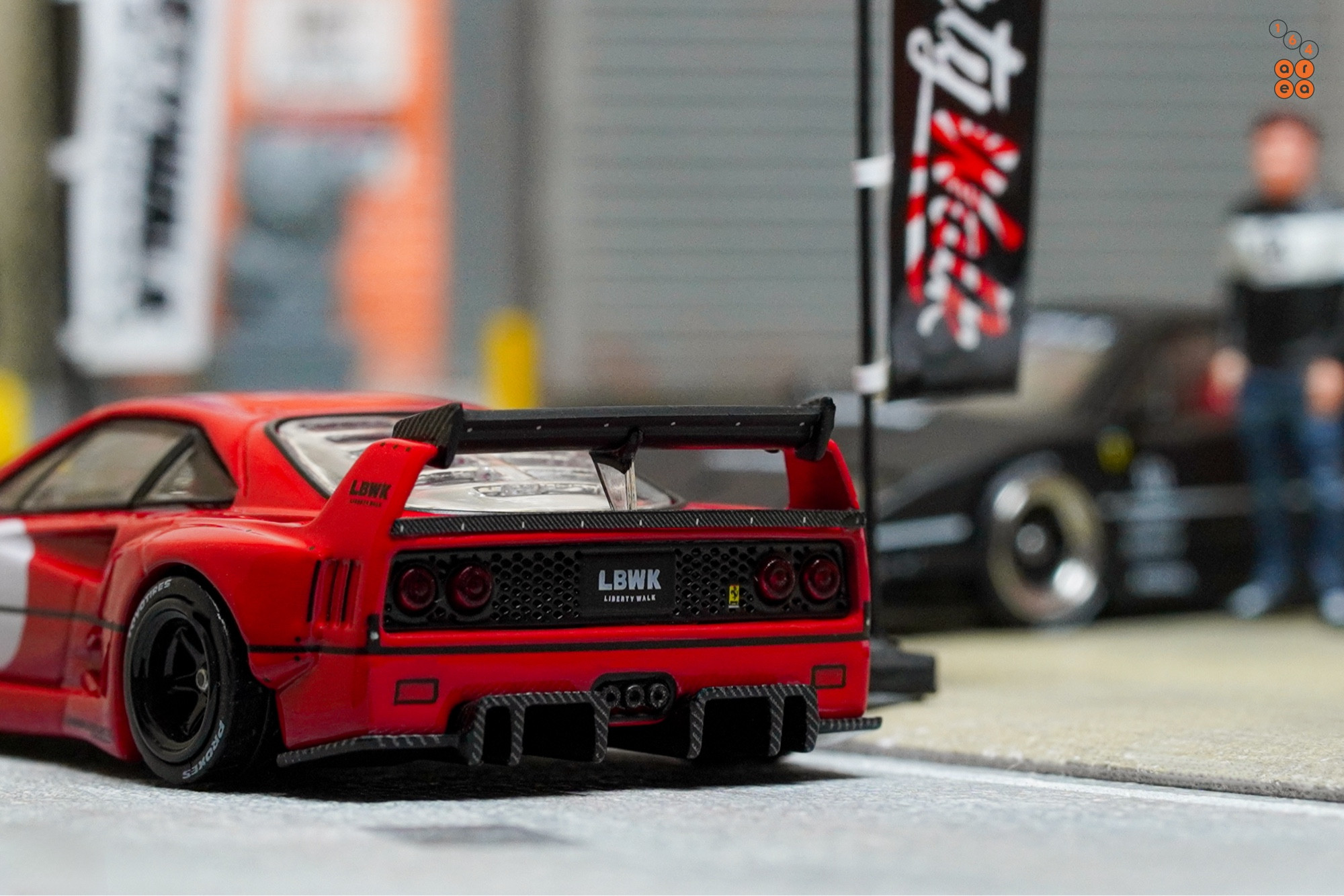 A red LB-WORKS Ferrari F40 by INNO64 in 1:64 scale on AREA 164