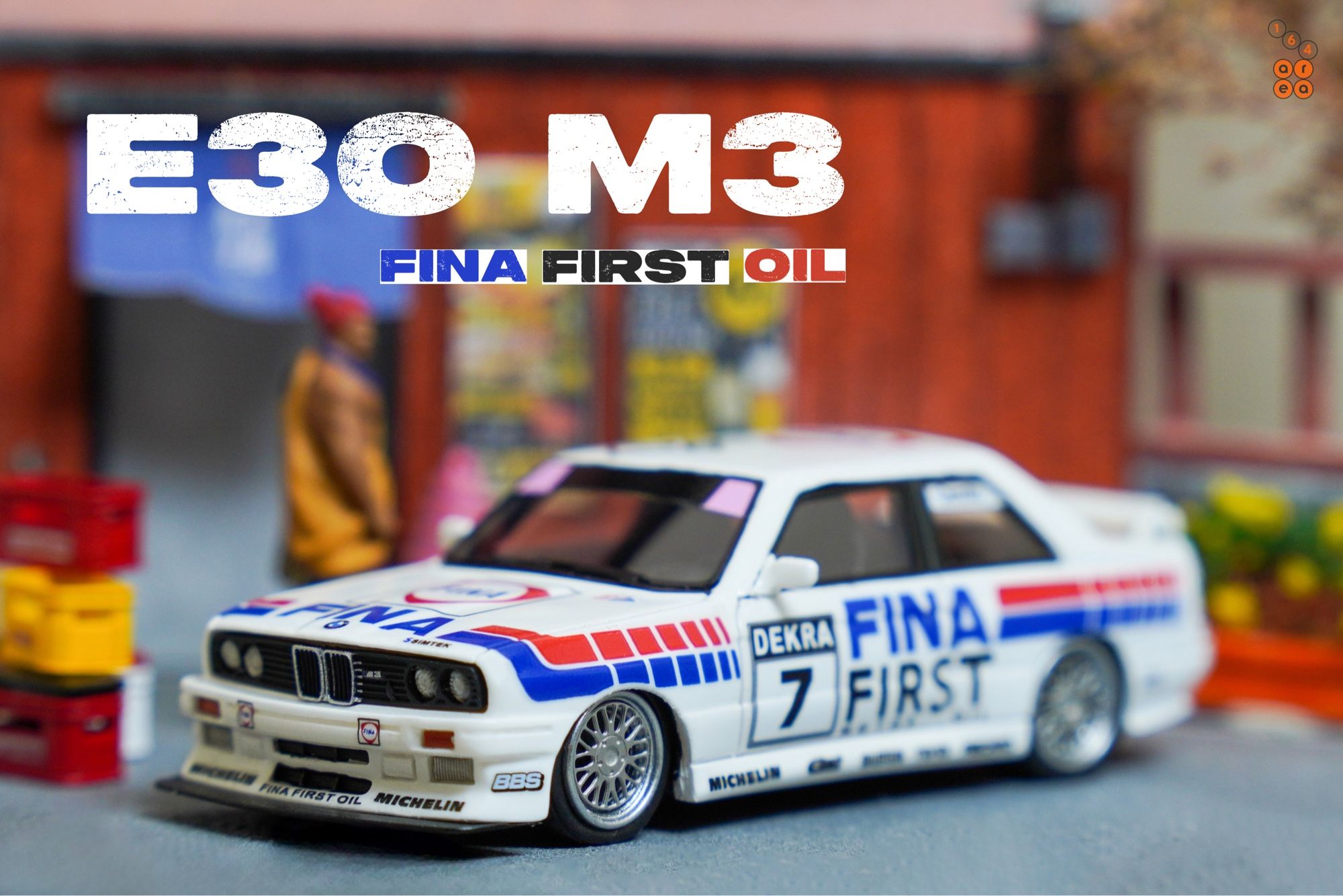 A left side of BMW E30 M3, FINA First Oil livery by ScaleMini in 1:64 scale with 1:64 figures on AREA 164