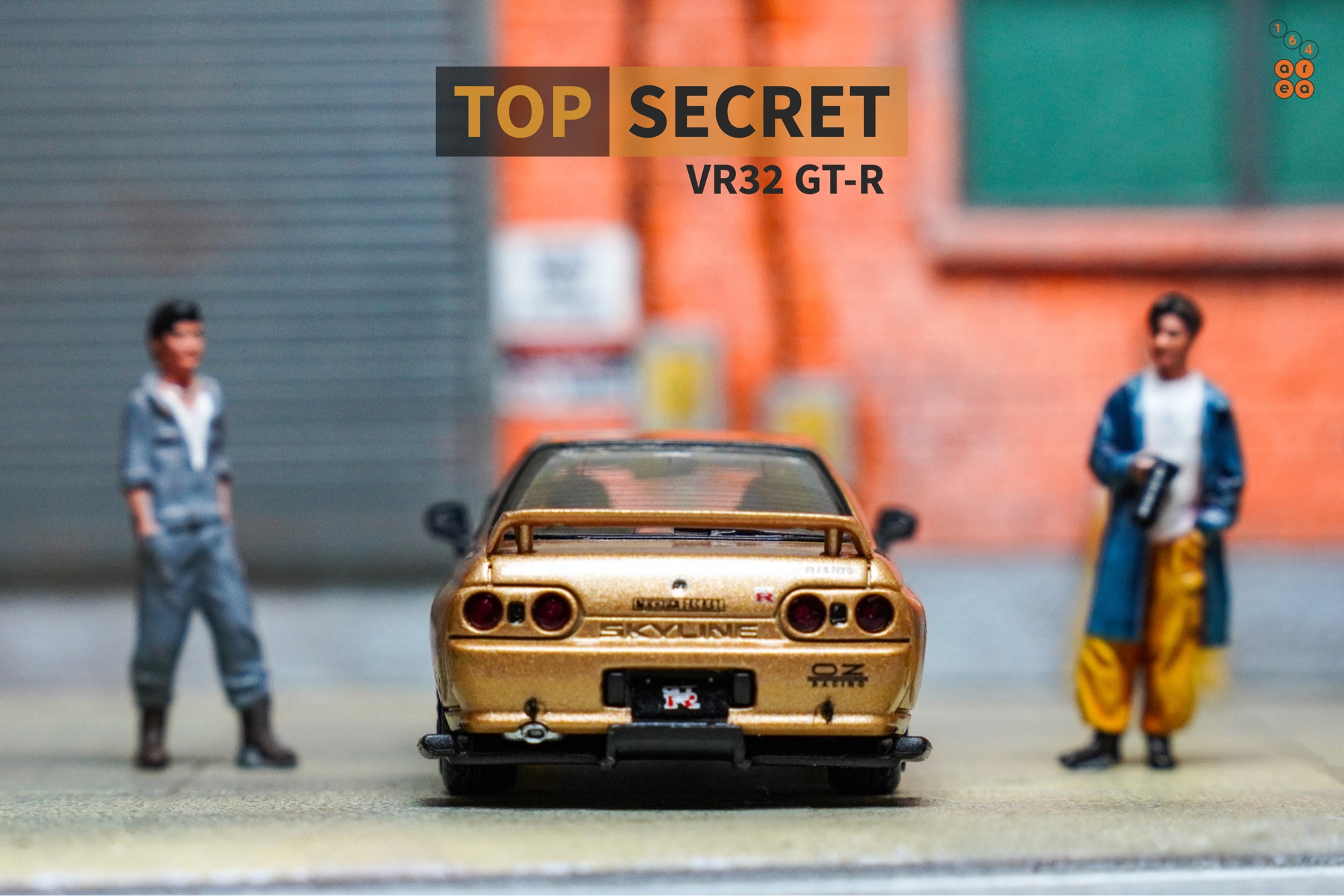 A rear side of Nissan Skyline GT-R VR32 Top Secret Gold by Facal Horizon in 1:64 scale with 1:64 figure on AREA 164