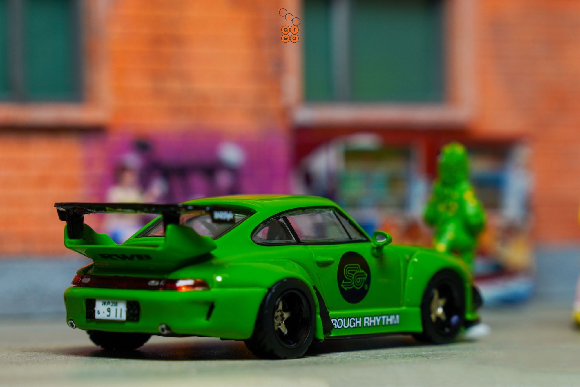 A right side of Porsche RWB 993 Rough Rhythm by Tarmac Works in 1:64 scale with 1:64 figures on AREA 164