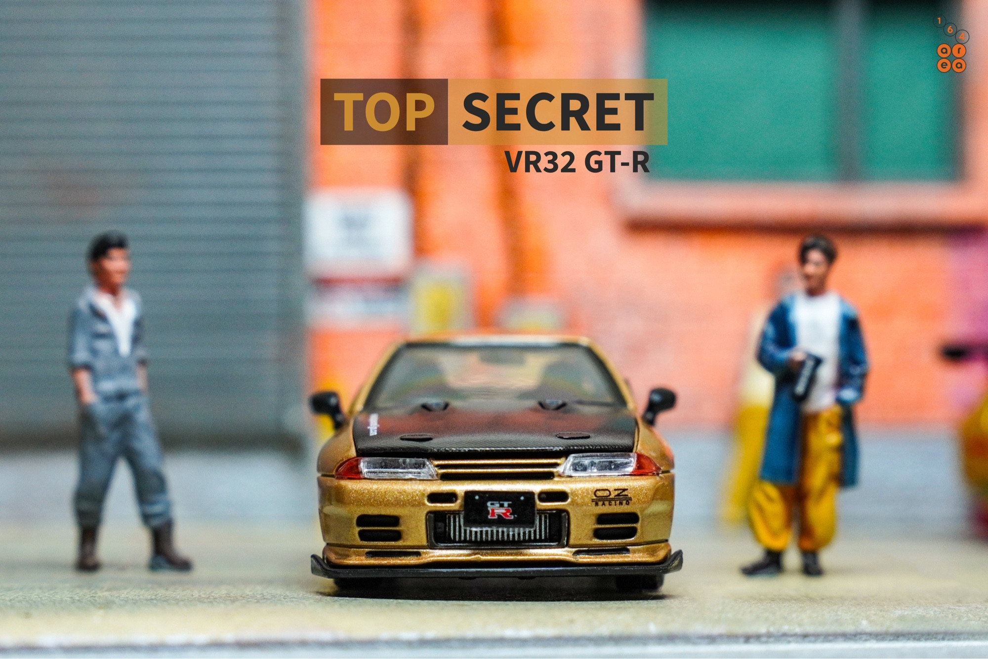 A front side of Nissan Skyline GT-R VR32 Top Secret Gold by Facal Horizon in 1:64 scale with 1:64 figure on AREA 164