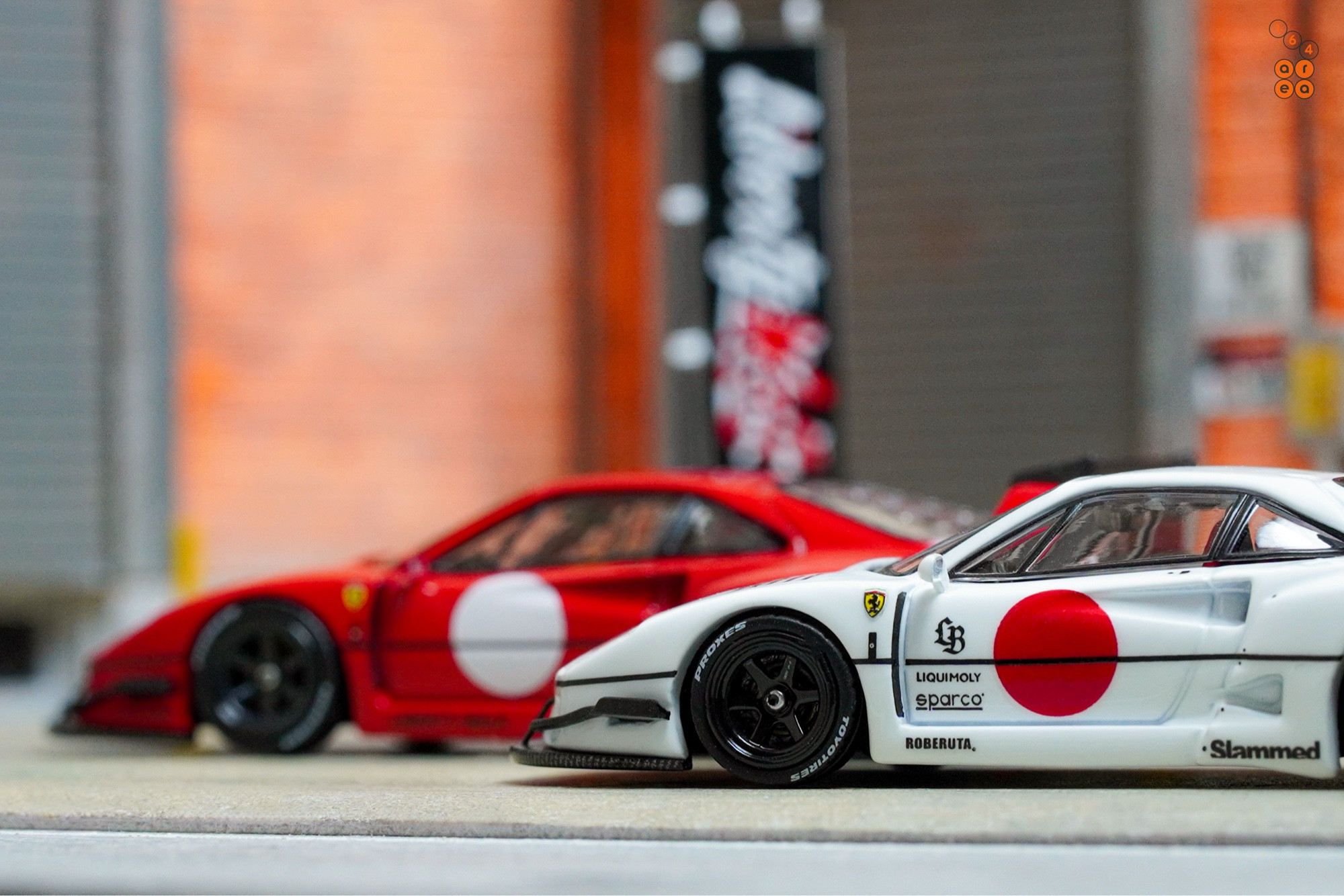 A red and a white LB-WORKS Ferrari F40 with Japan flag symbol by INNO64 in 1:64 scale on AREA 164