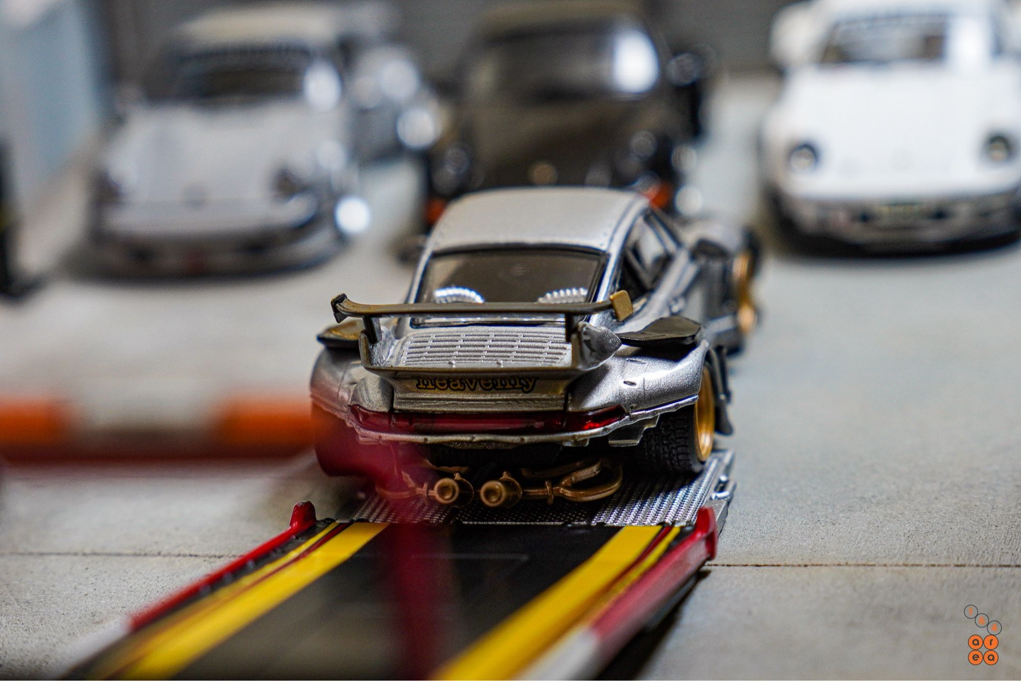 Porsche RWB 993 Ram-intra by Street Weapon in 1:64 scale with 1:64 figure on AREA 164