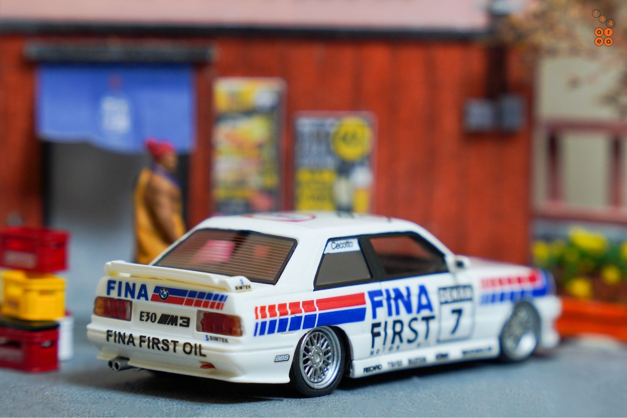 A right side of BMW E30 M3, FINA First Oil livery by ScaleMini in 1:64 scale with 1:64 figures on AREA 164