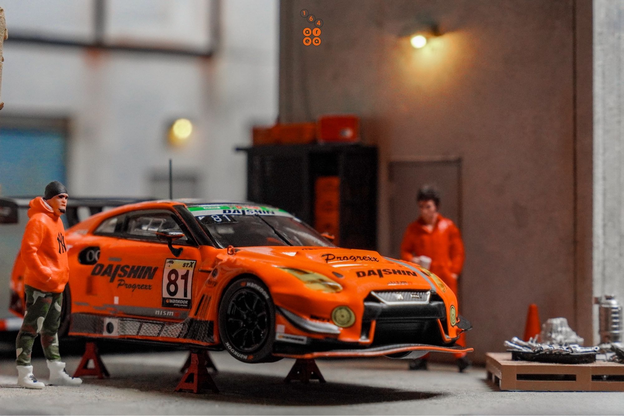 A Nissan GT-R Nismo GT3, Super Taikyu Series 2021, Fuji 24 hours 2021, No. 81 Winner by Tarmac Works in 1:64 scale with 1:64 figure on AREA 164