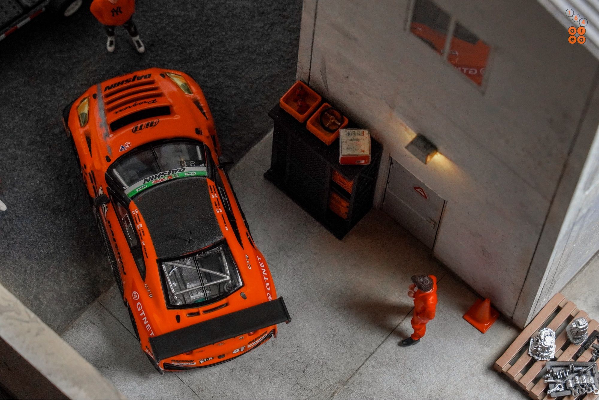 A top eye view of Nissan GT-R Nismo GT3, Super Taikyu Series 2021, Fuji 24 hours 2021, No. 81 Winner by Tarmac Works in 1:64 scale with 1:64 figures on AREA 164