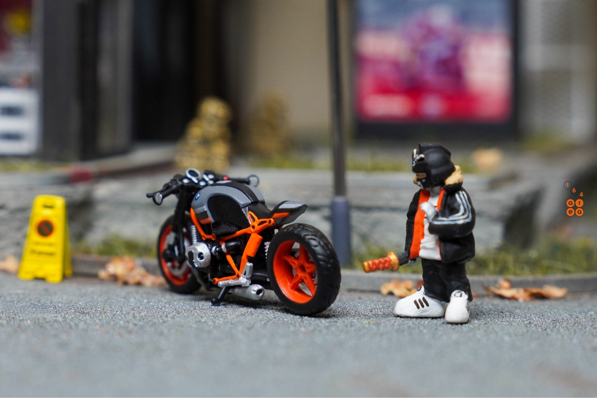 BMW R nineT in grey with orange accent in 1:64 scale with 1:64 figure on AREA 164