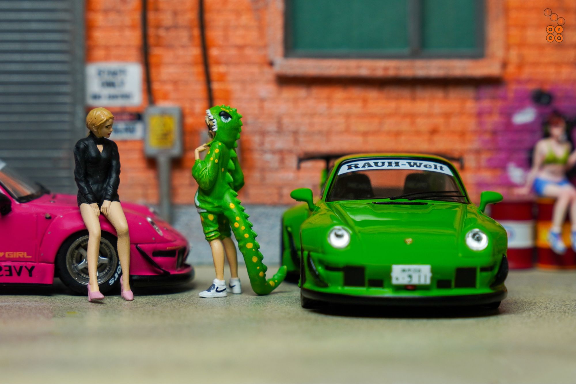 A female and a guy in cosplay suit beside Porsche RWB 993 Rough Rhythm by Tarmac Works in 1:64 scale with 1:64 figures on AREA 164