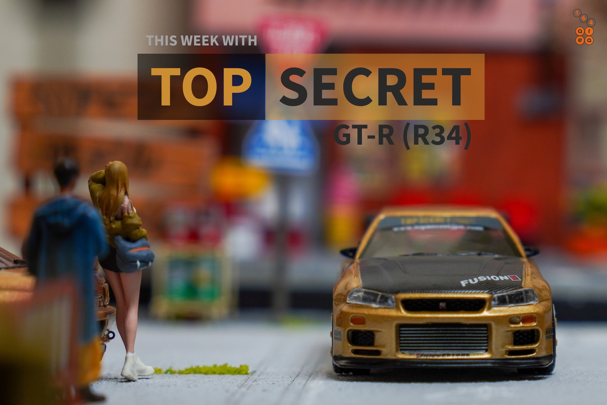 Nissan Skyline GT-R (R34) Top Secret, Top Secret Gold by MINI GT in 1:64 scale with 1:64 figures on AREA 164