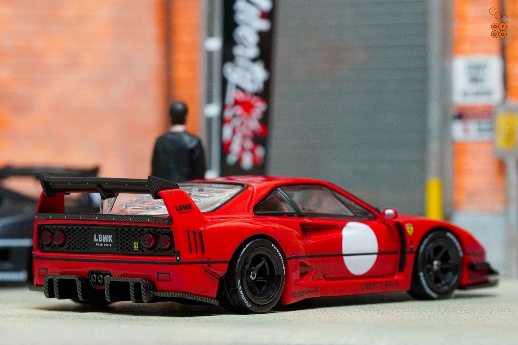 A right side of a red LB-WORKS Ferrari F40 by INNO64 in 1:64 scale on AREA 164