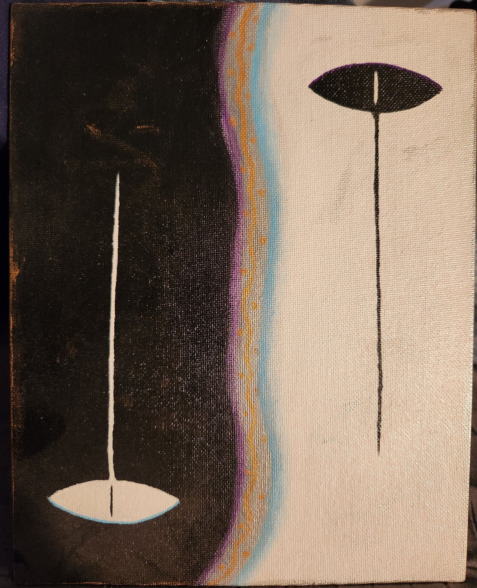 An abstract painting divided into to two sides to create a yin yang-like effect. The black side has a white upside-down eye with a white line rising up like a tear, while the white side has a black eye with a black line falling down like a tear. The two halves of the canvas are separated by a line painted in blue, purple, silver, and gold.