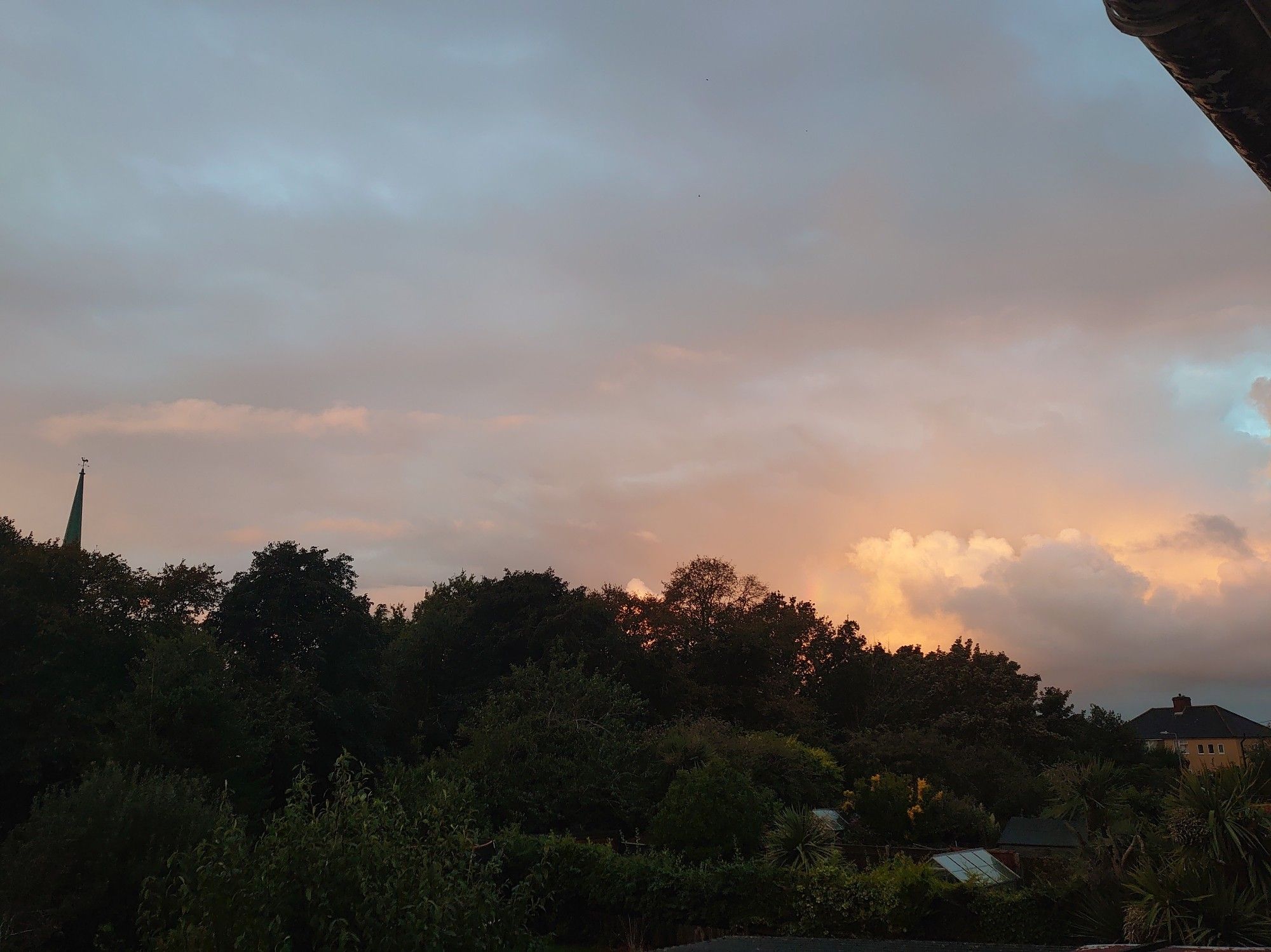 Looking south west from the north of St Margaret's church, Lowestoft, the sky a pink and blue hue of a stormy dawn morning