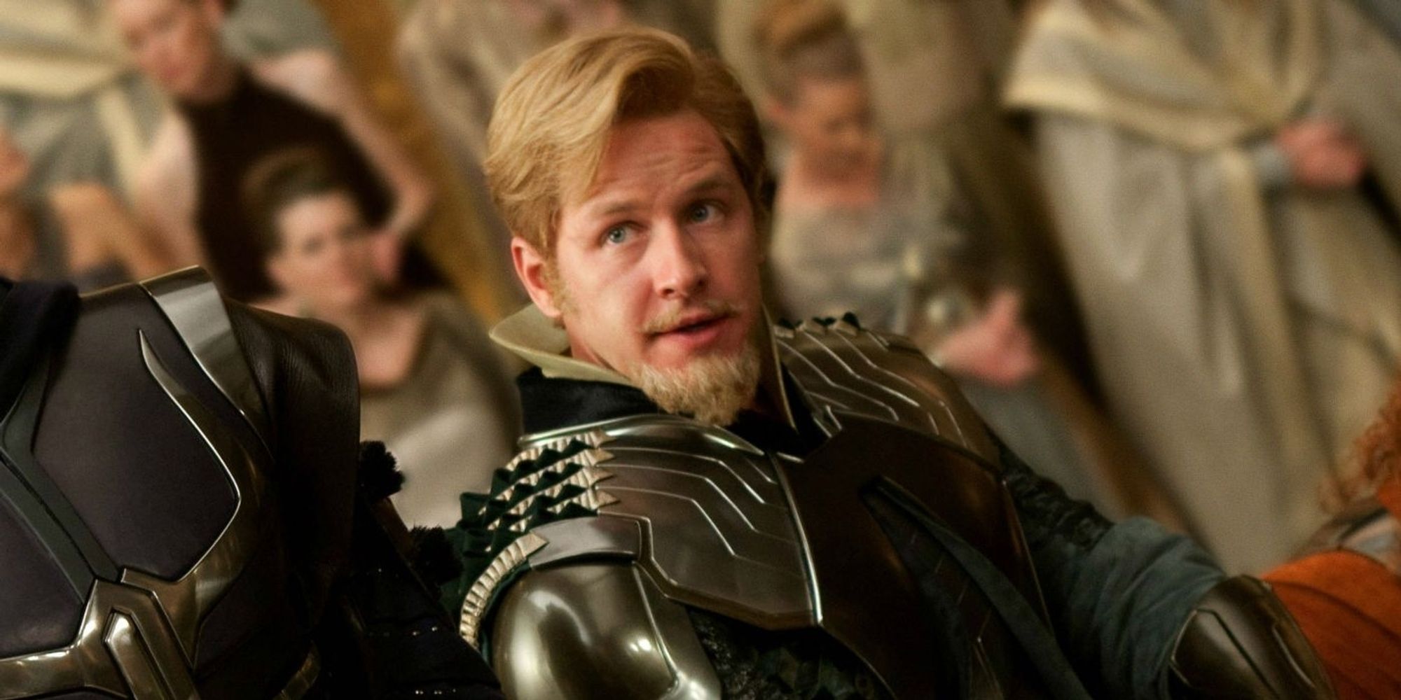 paul dallas from once upon a time as fandral of the warriors three in the first thor movie. he's channelling cary elwes with his classic robin hood charm, blonde coiff and van dyke beard, and green asgardian armor.